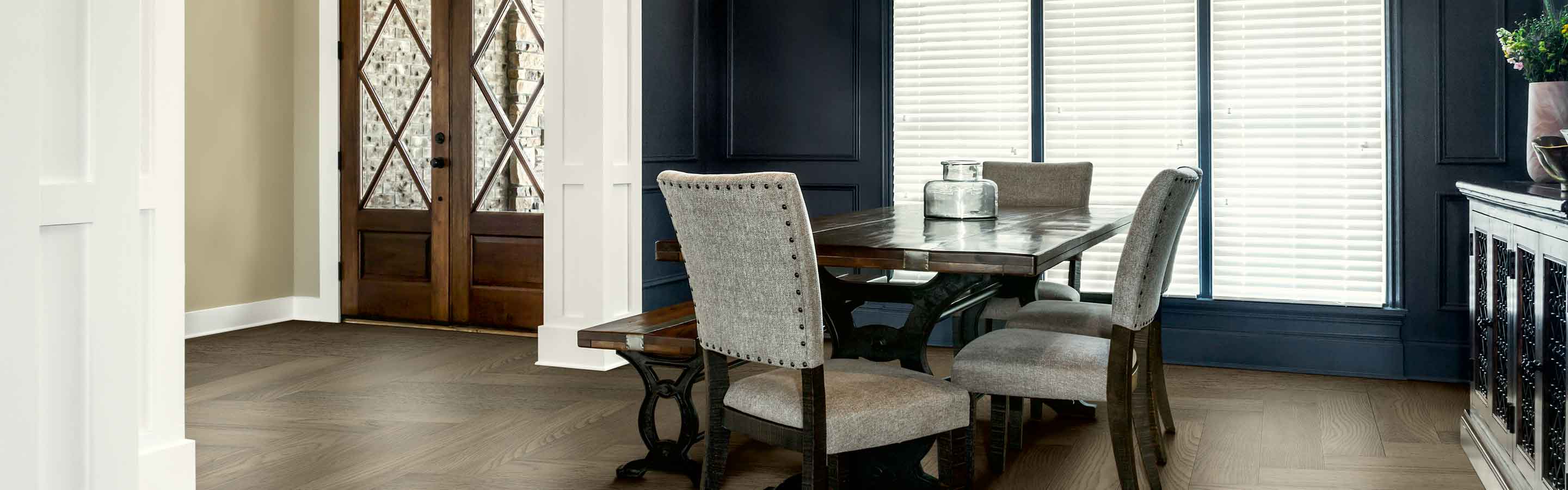 dining room with large windows covered with blinds